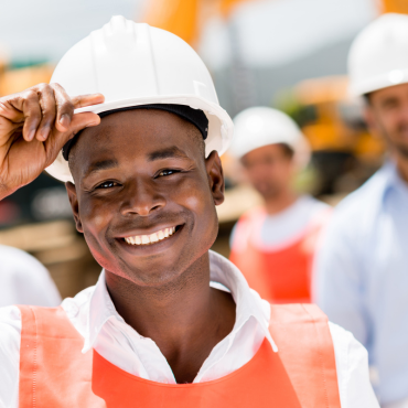 Smiing construction worker