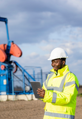 Tarius energy engineer holding a tab